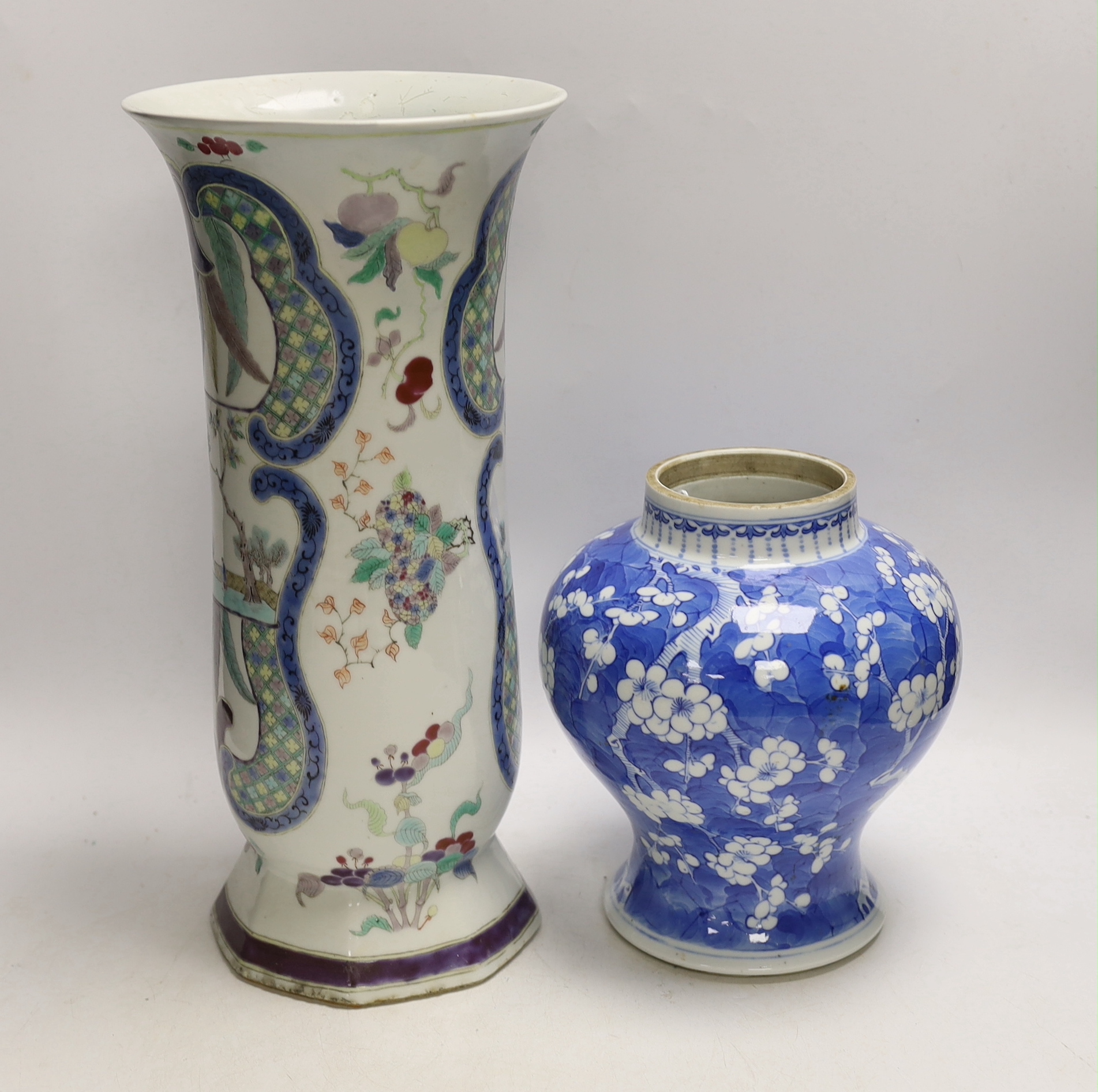 A Chinese enamelled felangcai porcelain beaker vase, 19th century and a 19th century Chinese blue and white Prunus vase, jar, 21cm high